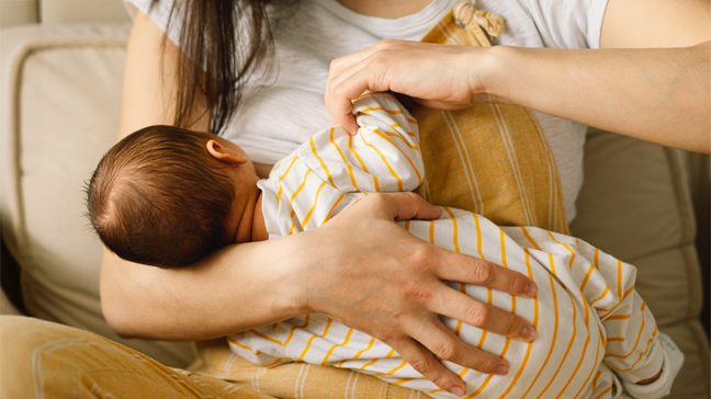 Close-up of a baby breastfeeding