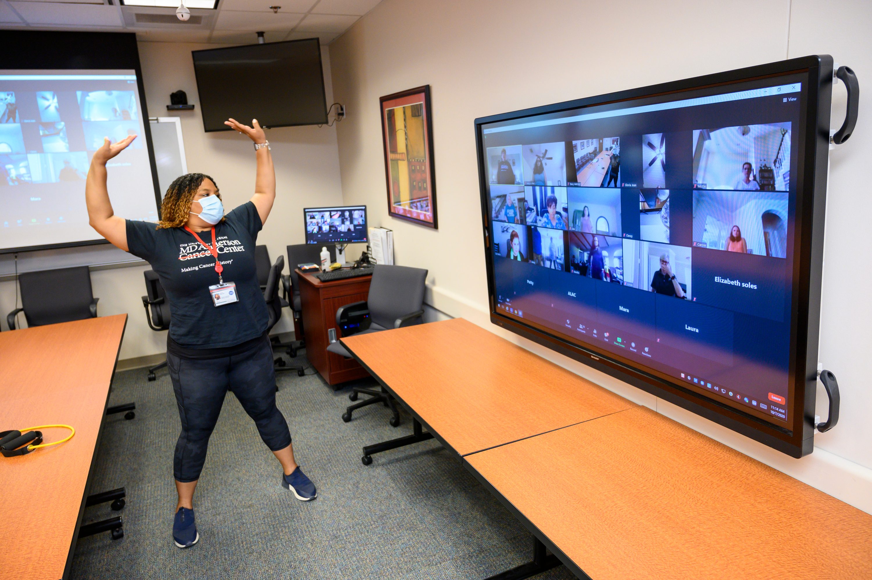 Instructor leading a virtual Active Living After Cancer exercise class on Zoom