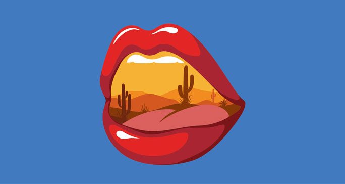 Stylized drawing of open mouth with desert landscape inside
