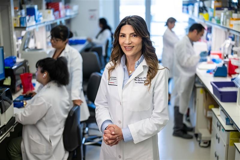 Dr. Katy Rezvani standing in a lab