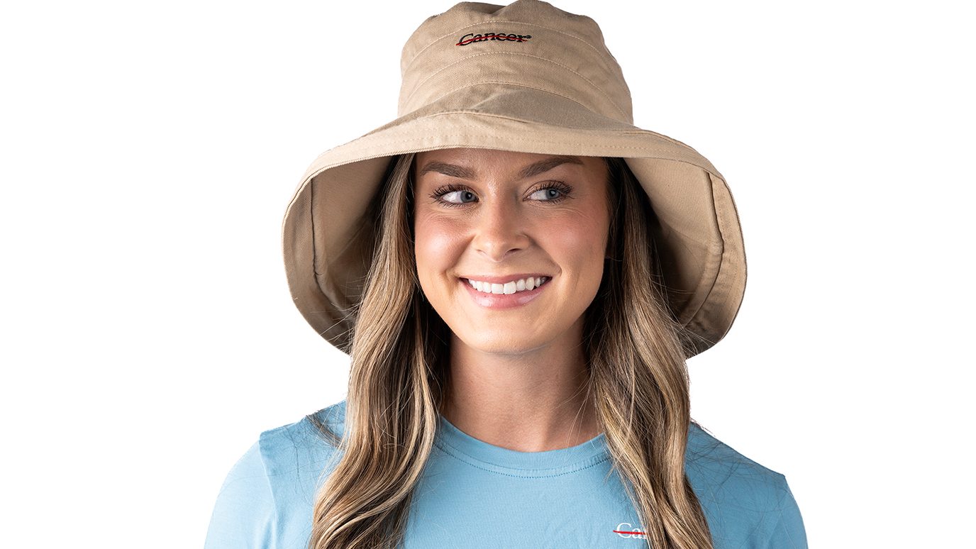 Sydney Barrera, a senior occupational therapist at MD Anderson, models a UPF 50+ sun hat and a long-sleeve T-shirt from our branded clothing collection. Its brim measures almost 5” wide – enough to shield the ears, neck and face from the sun’s rays.
