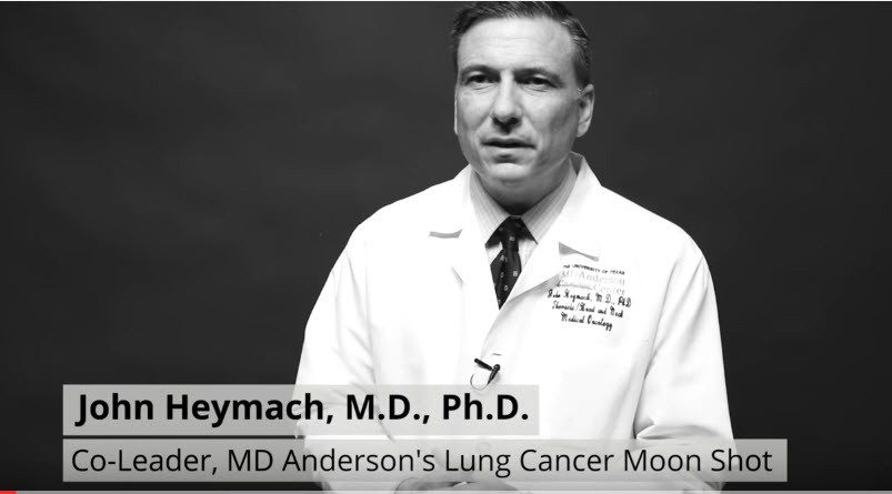 Dr. Heymach in white coat