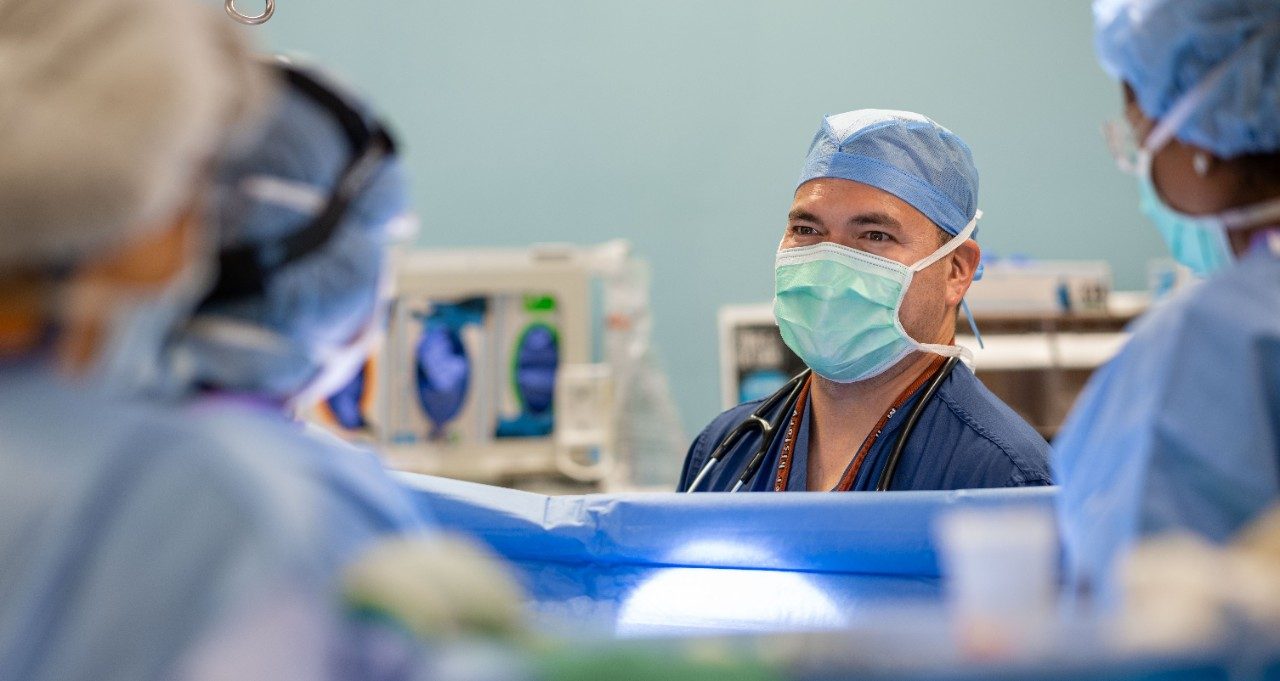 Jose Soliz, M.D., works in the operating room
