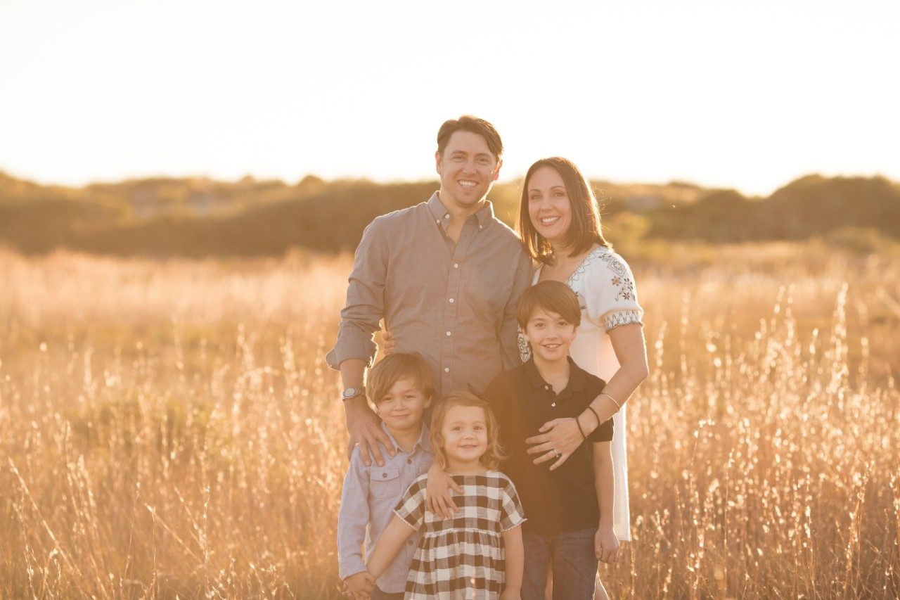 April Schweigert with her husband and children